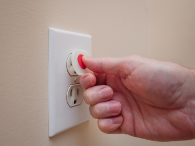Putting cover on electrical outlet